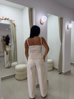 Cream peplum top and barrel pants